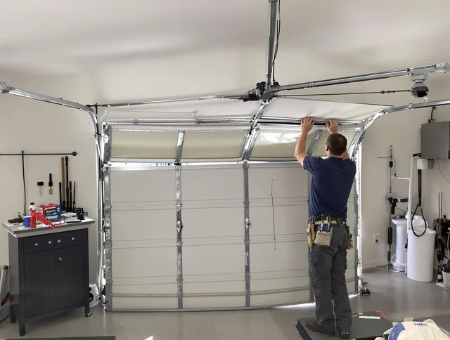 Matthews Garage Door Repair specialist performing precise section replacement on Matthews garage door